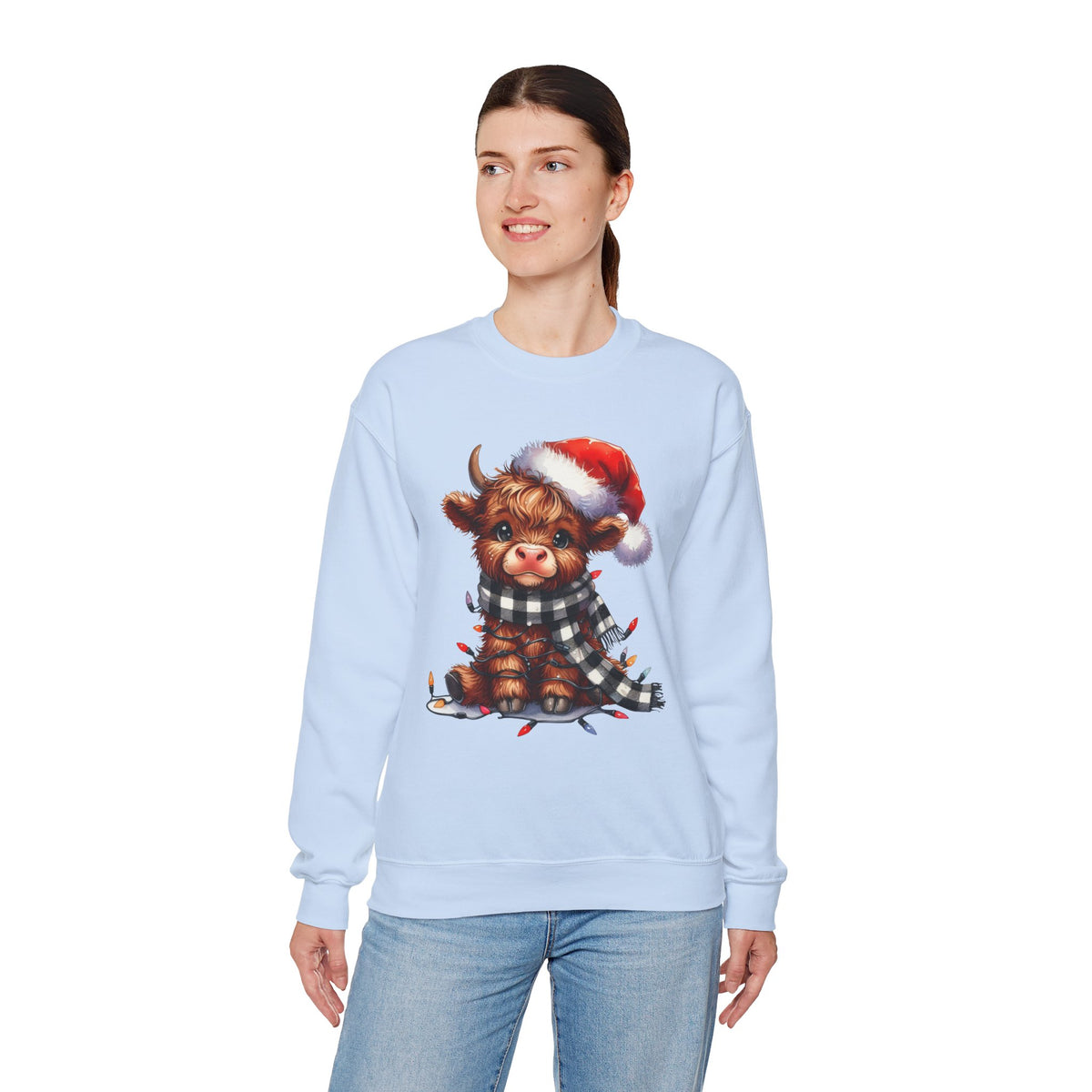 Cute Highland Cow Santa Hat Scarf Christmas Lights – Gildan Heavy Blend | Trendy Women’s Soft Sweatshirt. Direct to Garment. Printed & Shipped in the USA. Unisex Sizes.