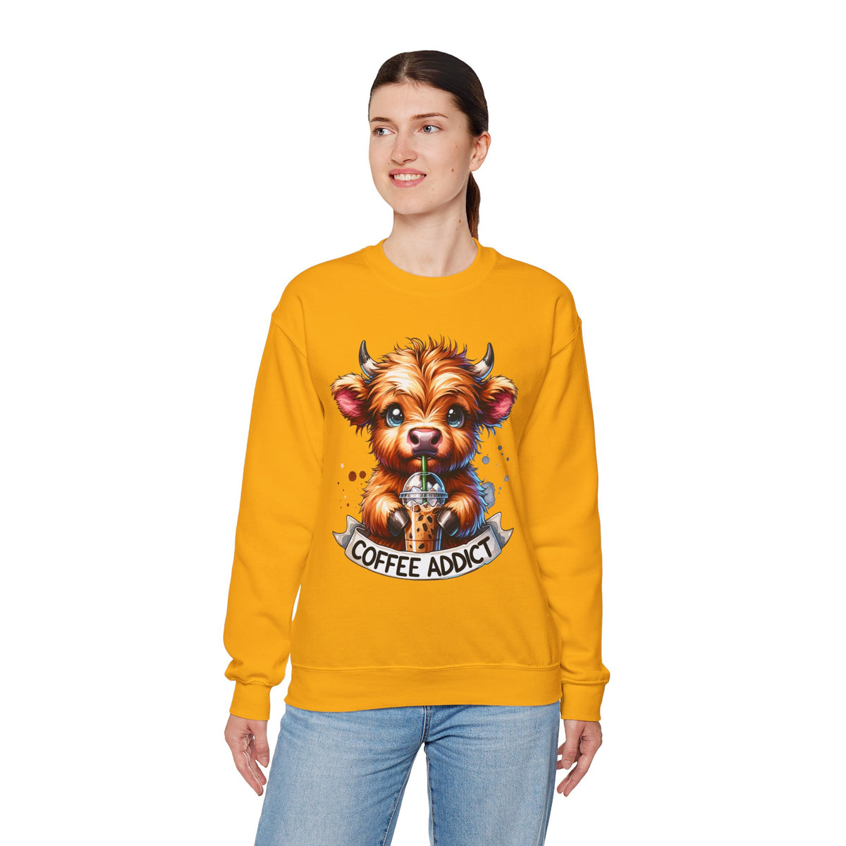 Coffee Addict Highland Cow Drinking Iced Coffee – Gildan Heavy Blend | Trendy Women’s Soft Sweatshirt. Direct to Garment. Printed & Shipped in the USA. Unisex Sizes.