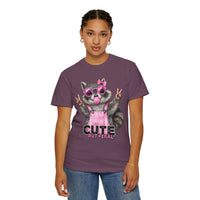 Cute But Feral, Raccoon in Pink Bibs - Comfort Colors | Trendy Women's T-Shirt. Direct to Garment. Printed & Shipped in the USA. Unisex Sizes.
