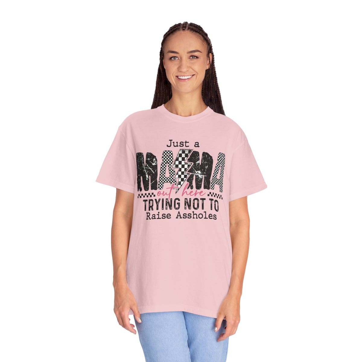 Just a Mama Out Here Trying Not To Raise Assholes - Comfort Colors | Trendy Women's T-Shirt. Direct to Garment. Printed & Shipped in the USA. Unisex Sizes.