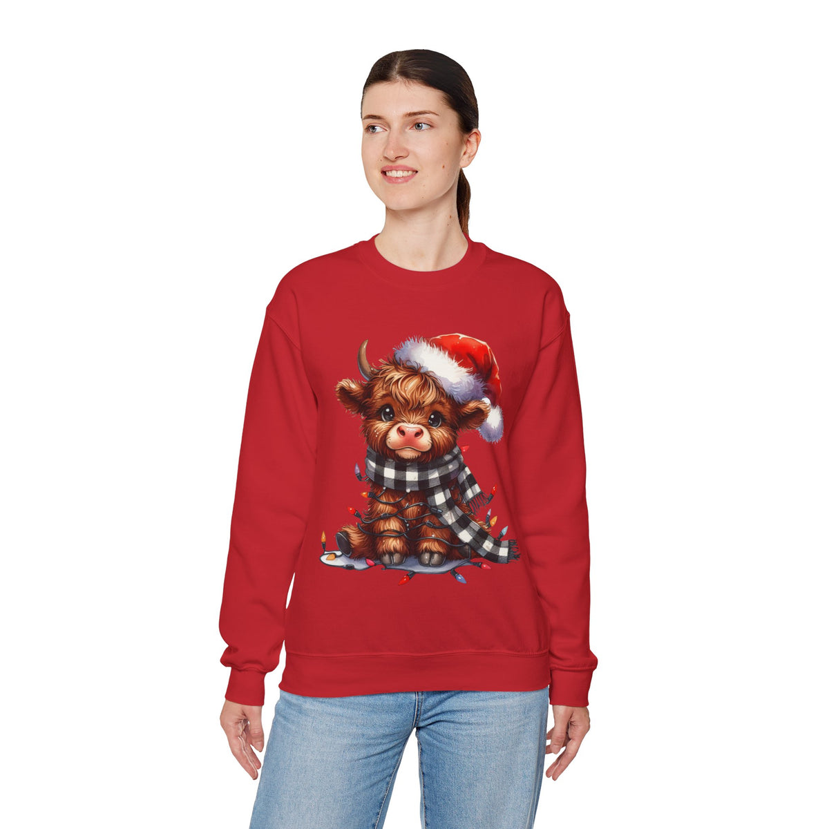 Cute Highland Cow Santa Hat Scarf Christmas Lights – Gildan Heavy Blend | Trendy Women’s Soft Sweatshirt. Direct to Garment. Printed & Shipped in the USA. Unisex Sizes.