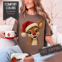 Cute Rudolph Faux Knit Look Reindeer w/Santa Hat - Comfort Colors | Trendy Women's T-Shirt. Direct to Garment. Printed & Shipped in the USA. Unisex Sizes.