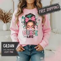 Nurse Life Messy Bun, Cute Stethoscope & Syringe – Gildan Heavy Blend | Trendy Women’s Soft Sweatshirt. Direct to Garment. Printed & Shipped in the USA. Unisex Sizes.