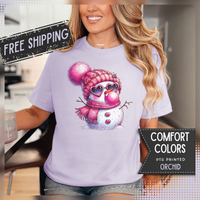 Pink Girly Snowman with Heart Sunglasses and Bubblegum Winter - Comfort Colors | Trendy Women's T-Shirt. Direct to Garment. Printed & Shipped in the USA. Unisex Sizes.