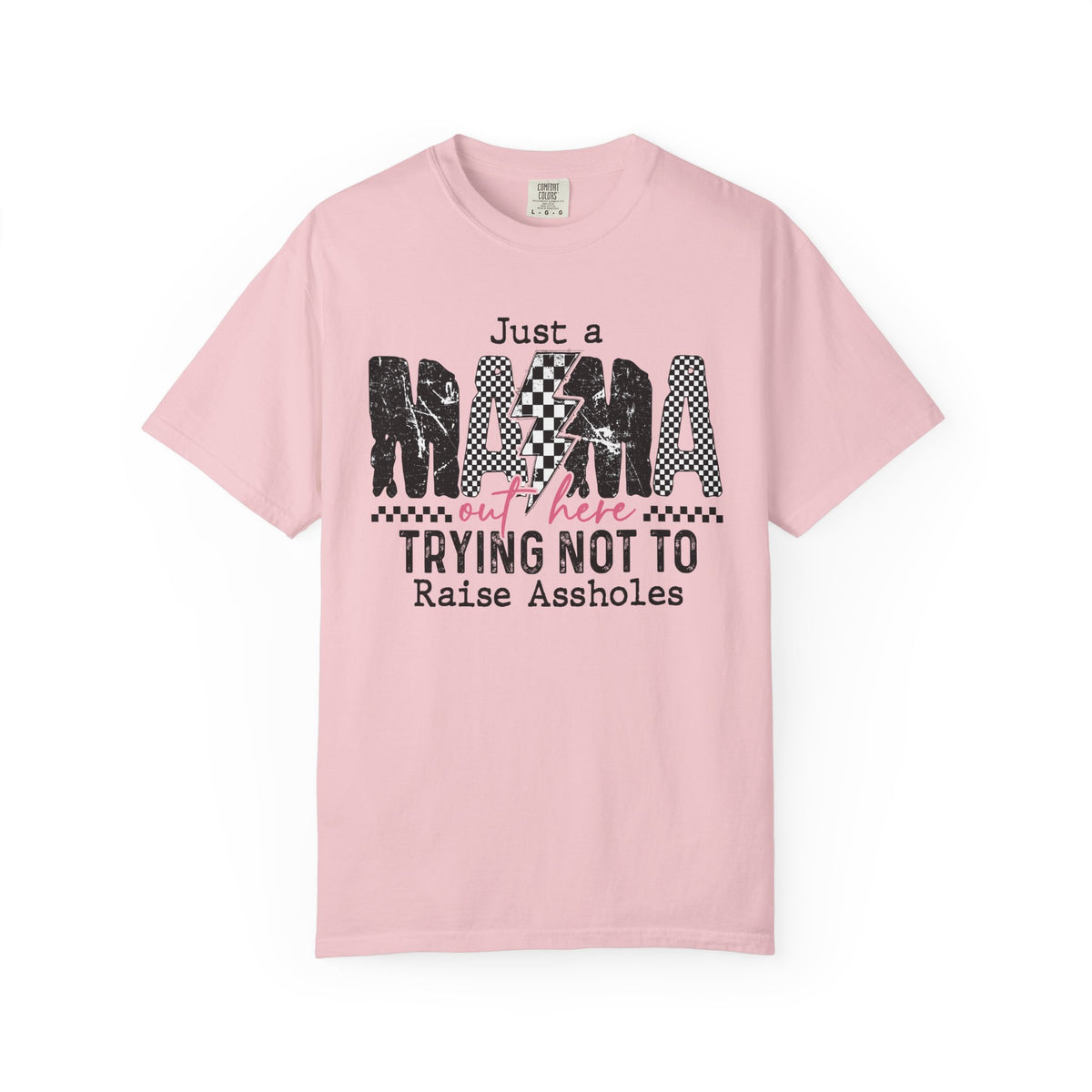 Just a Mama Out Here Trying Not To Raise Assholes - Comfort Colors | Trendy Women's T-Shirt. Direct to Garment. Printed & Shipped in the USA. Unisex Sizes.