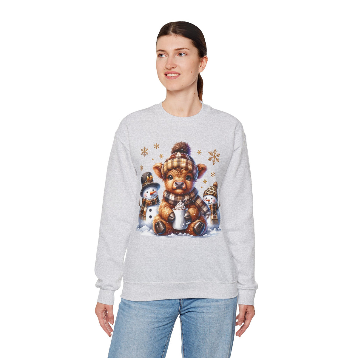 Cute Highland Cow with Snowmen, Winter – Gildan Heavy Blend | Trendy Women’s Soft Sweatshirt. Direct to Garment. Printed & Shipped in the USA. Unisex Sizes.