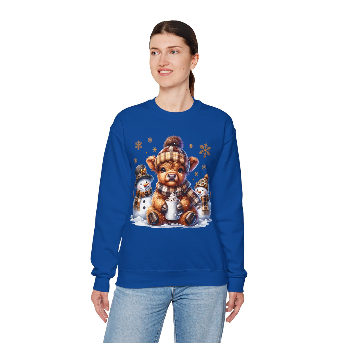Cute Highland Cow with Snowmen, Winter – Gildan Heavy Blend | Trendy Women’s Soft Sweatshirt. Direct to Garment. Printed & Shipped in the USA. Unisex Sizes.