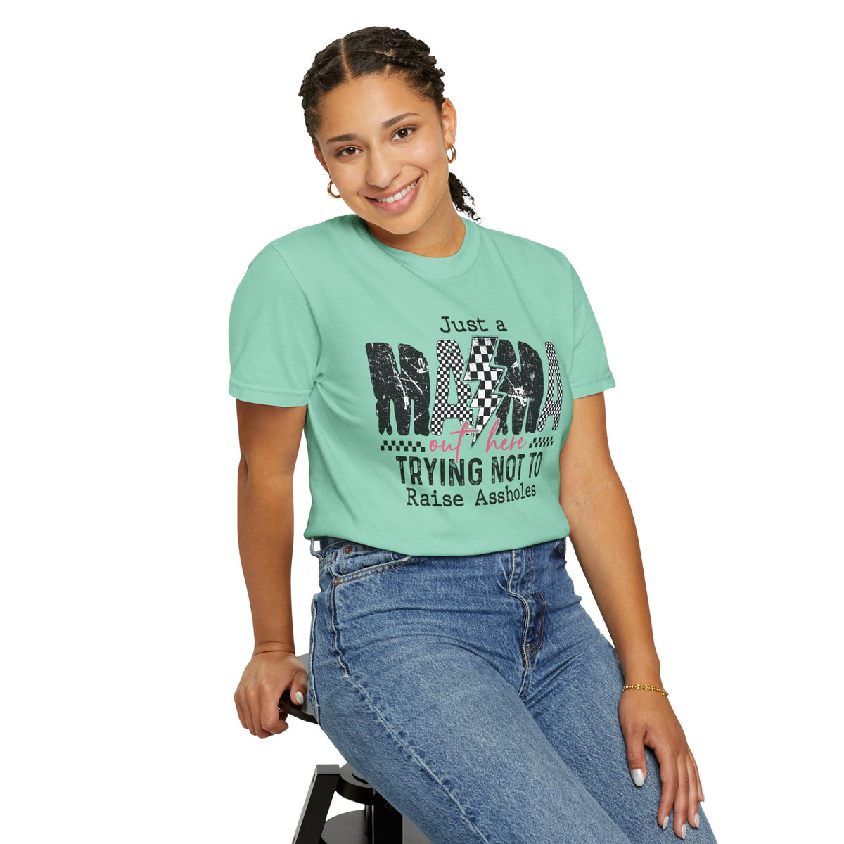 Just a Mama Out Here Trying Not To Raise Assholes - Comfort Colors | Trendy Women's T-Shirt. Direct to Garment. Printed & Shipped in the USA. Unisex Sizes.