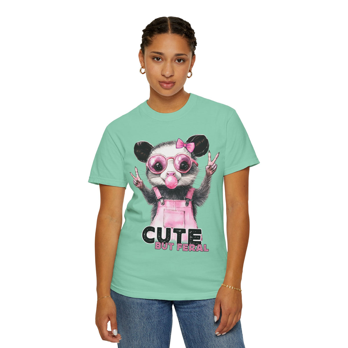 Cute But Feral, Possum in Pink Bibs - Comfort Colors | Trendy Women's T-Shirt. Direct to Garment. Printed & Shipped in the USA. Unisex Sizes.