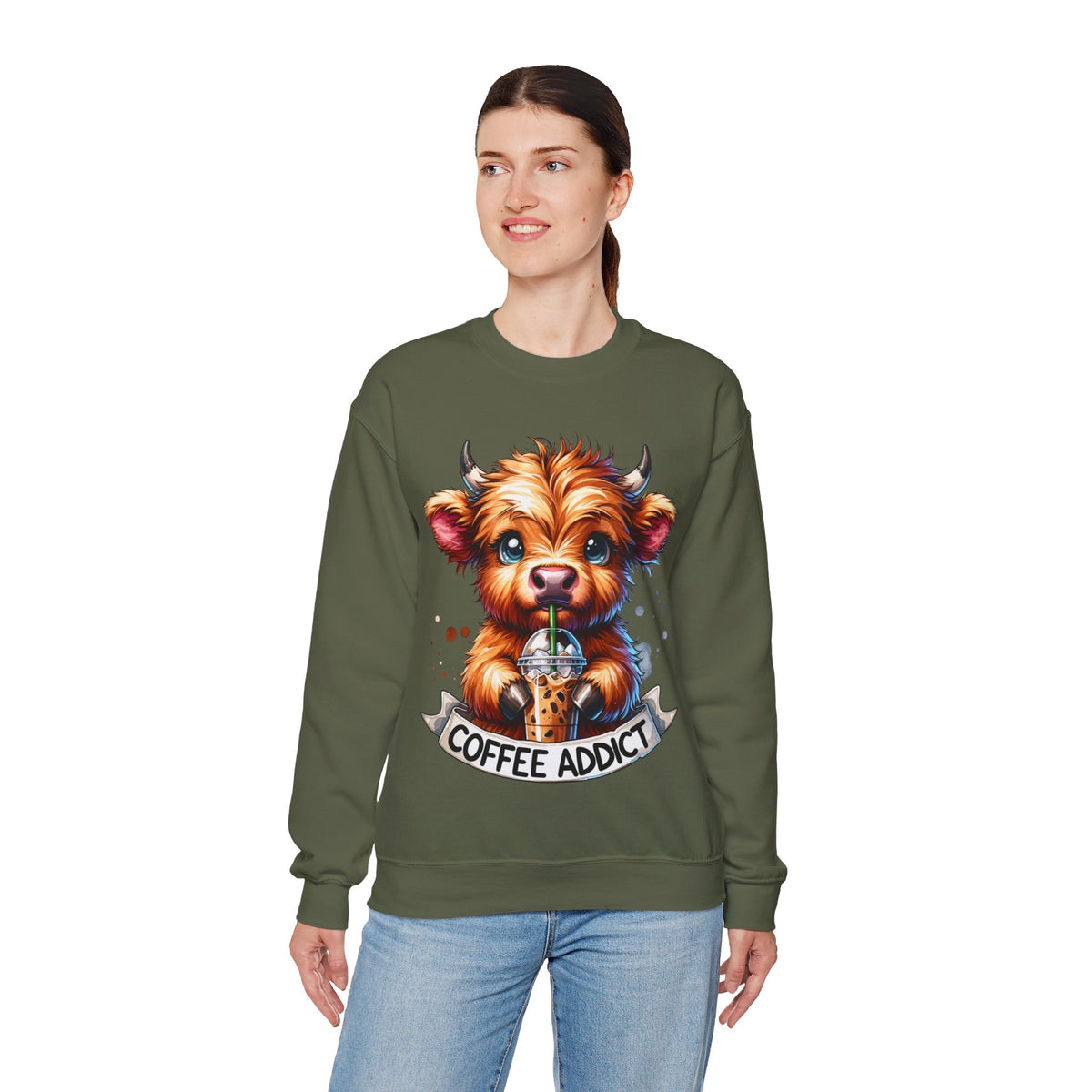Coffee Addict Highland Cow Drinking Iced Coffee – Gildan Heavy Blend | Trendy Women’s Soft Sweatshirt. Direct to Garment. Printed & Shipped in the USA. Unisex Sizes.