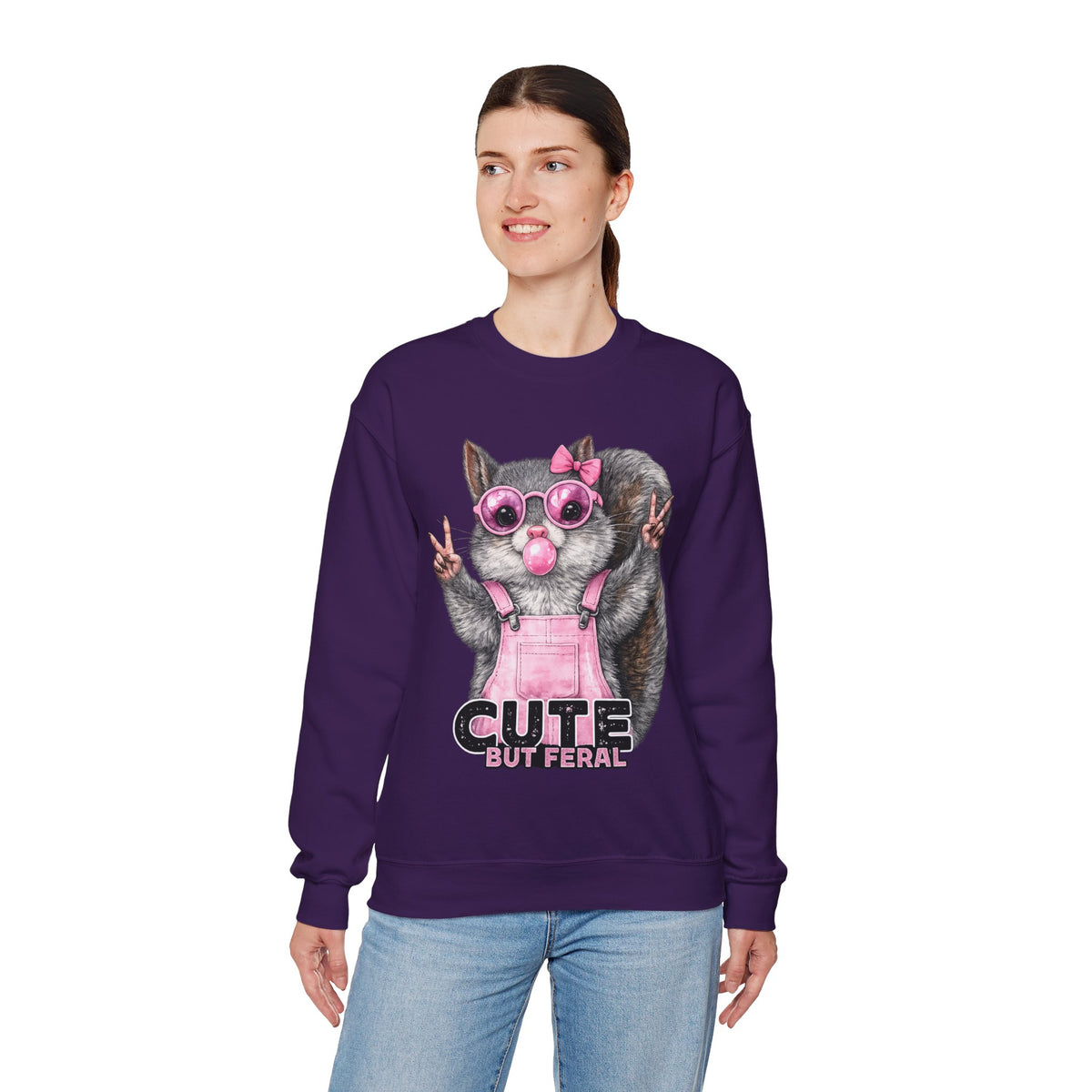 Cute But Feral, Squirrel in Pink Bibs – Gildan Heavy Blend | Trendy Women’s Soft Sweatshirt. Direct to Garment. Printed & Shipped in the USA. Unisex Sizes.