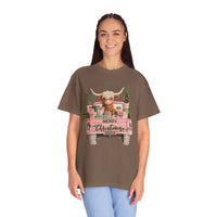 Highland Cow in Pink Truck Merry Christmas Holiday Farmhouse - Comfort Colors | Trendy Women's T-Shirt. Direct to Garment. Printed & Shipped in the USA. Unisex Sizes.