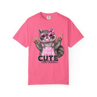 Cute But Feral, Raccoon in Pink Bibs - Comfort Colors | Trendy Women's T-Shirt. Direct to Garment. Printed & Shipped in the USA. Unisex Sizes.