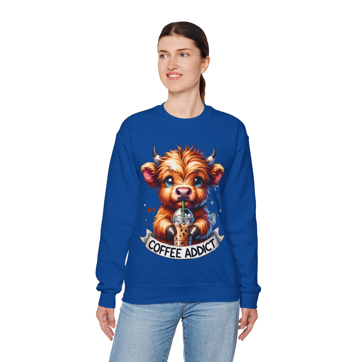 Coffee Addict Highland Cow Drinking Iced Coffee – Gildan Heavy Blend | Trendy Women’s Soft Sweatshirt. Direct to Garment. Printed & Shipped in the USA. Unisex Sizes.