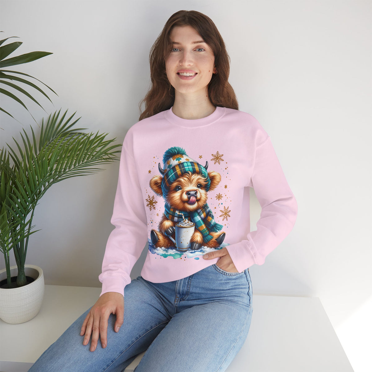 Winter Baby Highland Cow with Cocoa – Gildan Heavy Blend | Trendy Women’s Soft Sweatshirt. Direct to Garment. Printed & Shipped in the USA. Unisex Sizes.