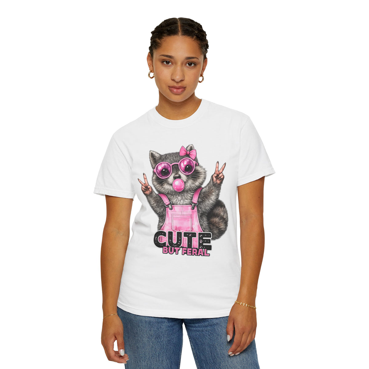 Cute But Feral, Raccoon in Pink Bibs - Comfort Colors | Trendy Women's T-Shirt. Direct to Garment. Printed & Shipped in the USA. Unisex Sizes.