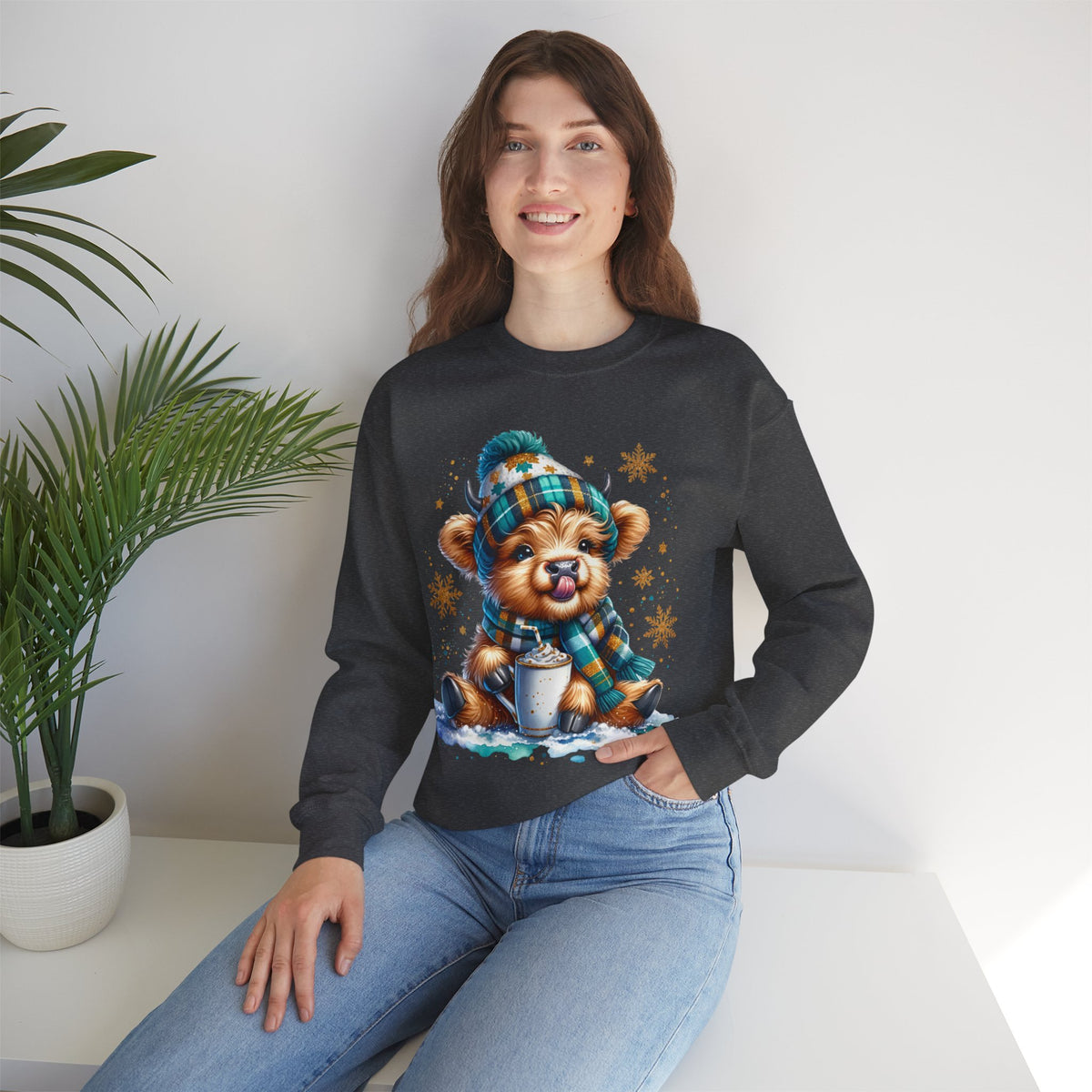 Winter Baby Highland Cow with Cocoa – Gildan Heavy Blend | Trendy Women’s Soft Sweatshirt. Direct to Garment. Printed & Shipped in the USA. Unisex Sizes.