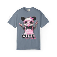 Cute But Feral, Possum in Pink Bibs - Comfort Colors | Trendy Women's T-Shirt. Direct to Garment. Printed & Shipped in the USA. Unisex Sizes.