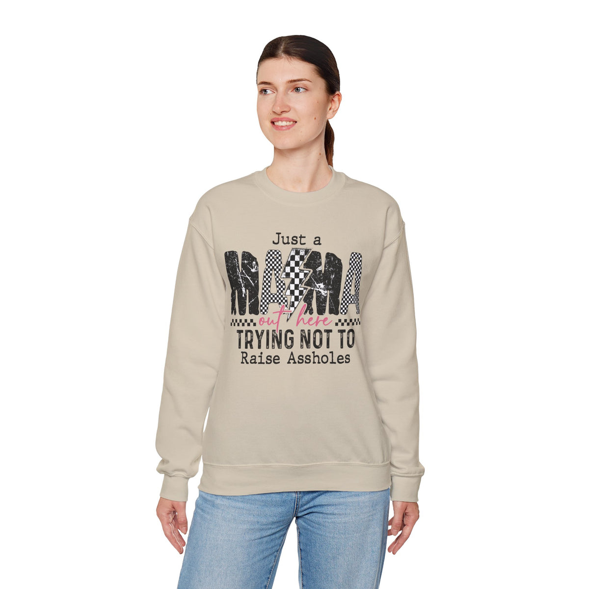 Just a Mama Out Here Trying Not To Raise Assholes – Gildan Heavy Blend | Trendy Women’s Soft Sweatshirt. Direct to Garment. Printed & Shipped in the USA. Unisex Sizes.