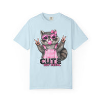 Cute But Feral, Raccoon in Pink Bibs - Comfort Colors | Trendy Women's T-Shirt. Direct to Garment. Printed & Shipped in the USA. Unisex Sizes.