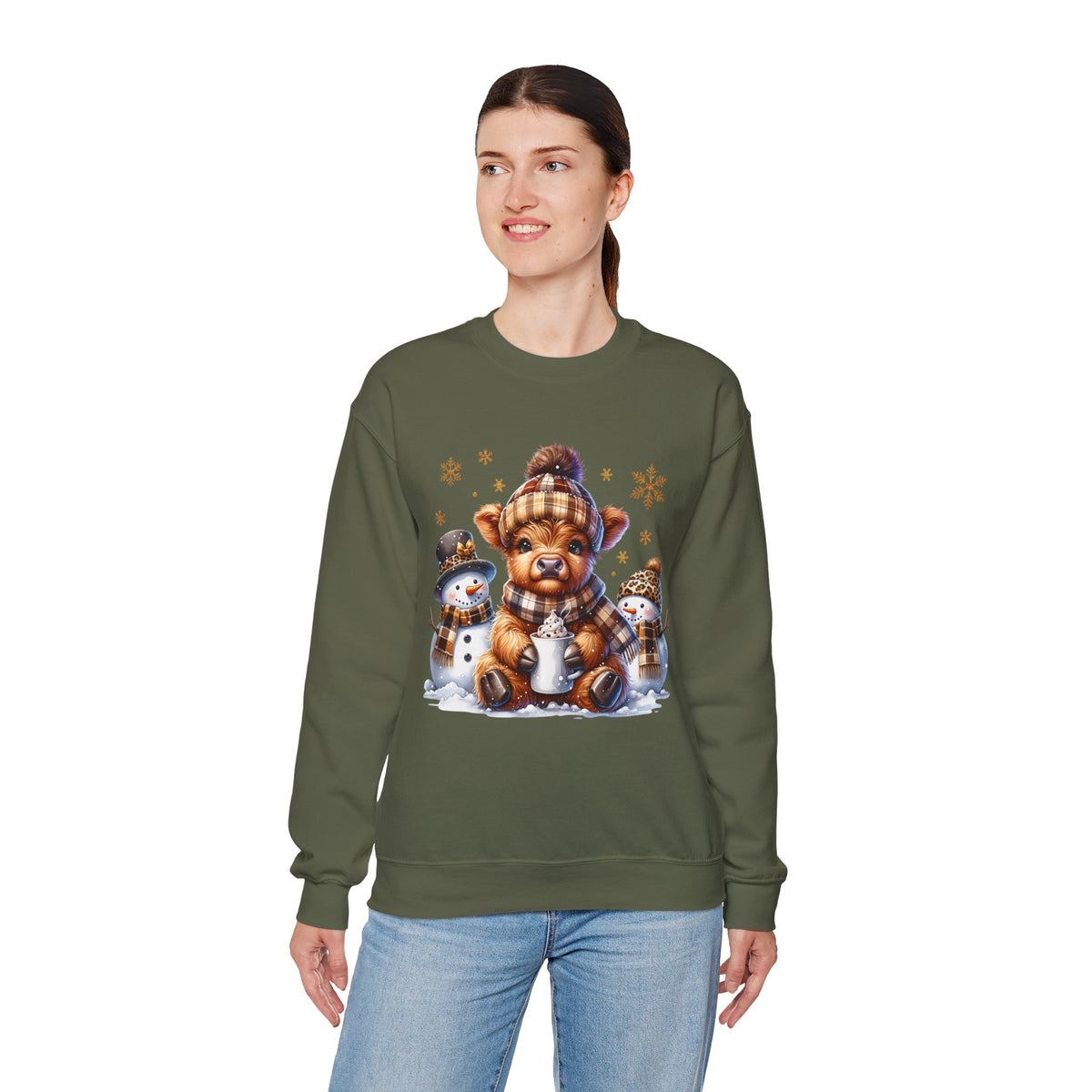 Cute Highland Cow with Snowmen, Winter – Gildan Heavy Blend | Trendy Women’s Soft Sweatshirt. Direct to Garment. Printed & Shipped in the USA. Unisex Sizes.