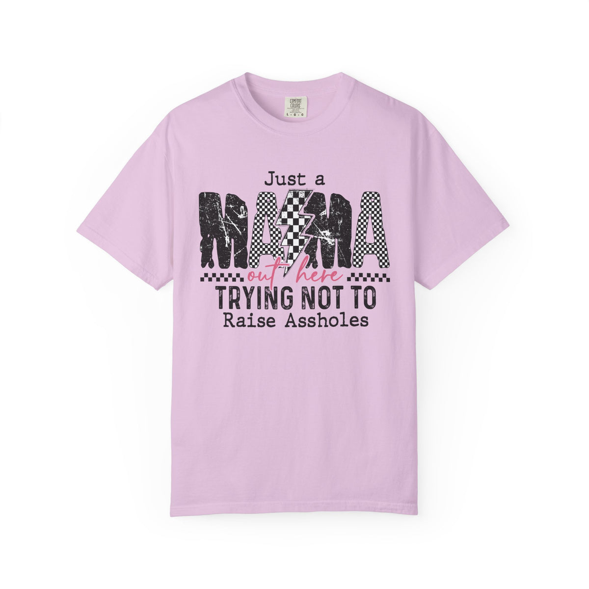 Just a Mama Out Here Trying Not To Raise Assholes - Comfort Colors | Trendy Women's T-Shirt. Direct to Garment. Printed & Shipped in the USA. Unisex Sizes.