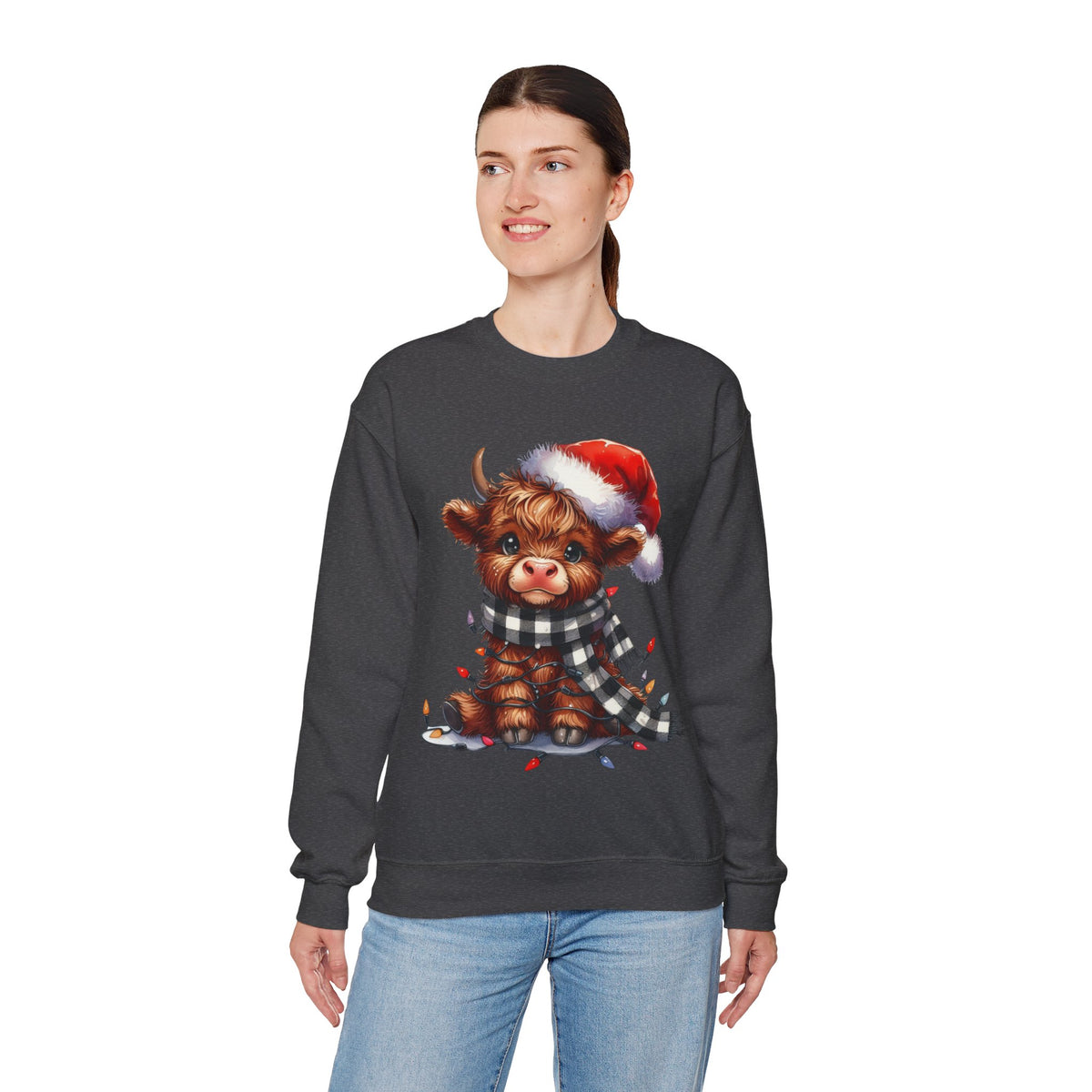 Cute Highland Cow Santa Hat Scarf Christmas Lights – Gildan Heavy Blend | Trendy Women’s Soft Sweatshirt. Direct to Garment. Printed & Shipped in the USA. Unisex Sizes.