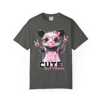 Cute But Feral, Possum in Pink Bibs - Comfort Colors | Trendy Women's T-Shirt. Direct to Garment. Printed & Shipped in the USA. Unisex Sizes.