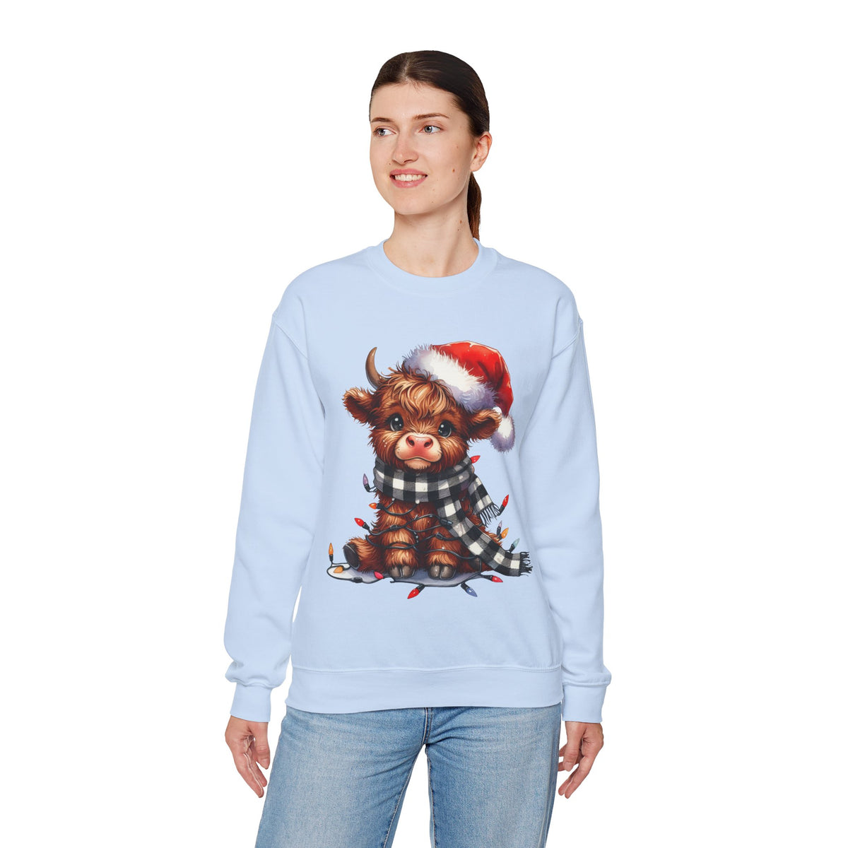 Cute Highland Cow Santa Hat Scarf Christmas Lights – Gildan Heavy Blend | Trendy Women’s Soft Sweatshirt. Direct to Garment. Printed & Shipped in the USA. Unisex Sizes.