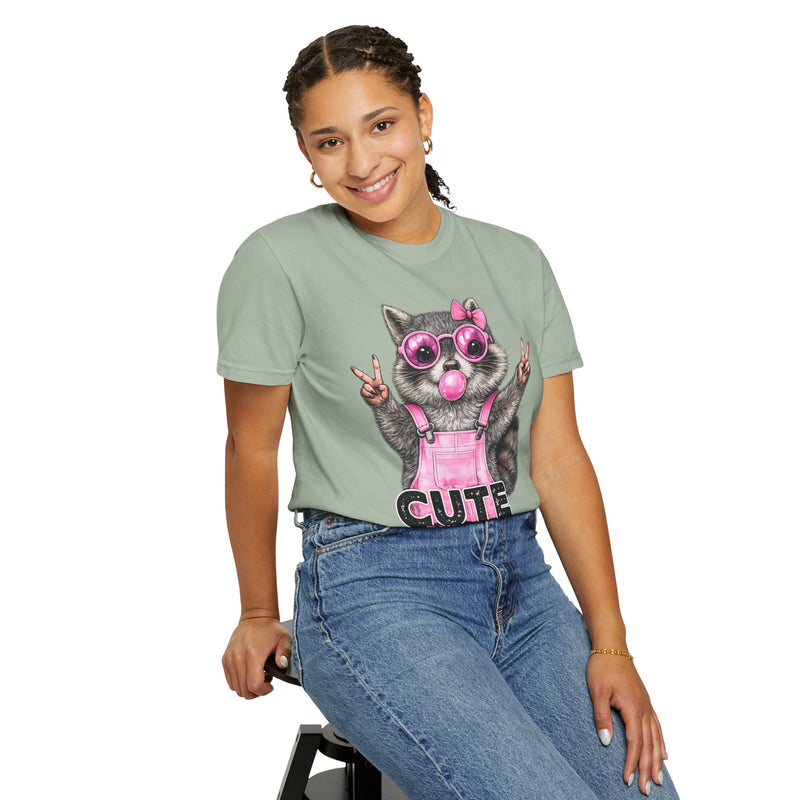 Cute But Feral, Raccoon in Pink Bibs - Comfort Colors | Trendy Women's T-Shirt. Direct to Garment. Printed & Shipped in the USA. Unisex Sizes.
