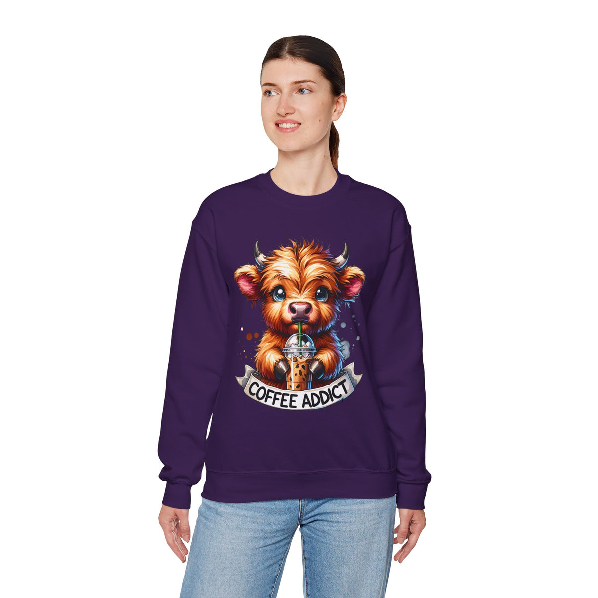 Coffee Addict Highland Cow Drinking Iced Coffee – Gildan Heavy Blend | Trendy Women’s Soft Sweatshirt. Direct to Garment. Printed & Shipped in the USA. Unisex Sizes.
