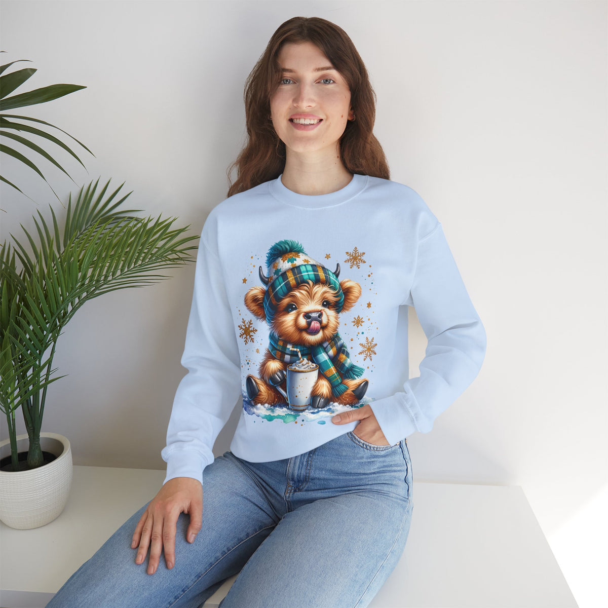 Winter Baby Highland Cow with Cocoa – Gildan Heavy Blend | Trendy Women’s Soft Sweatshirt. Direct to Garment. Printed & Shipped in the USA. Unisex Sizes.