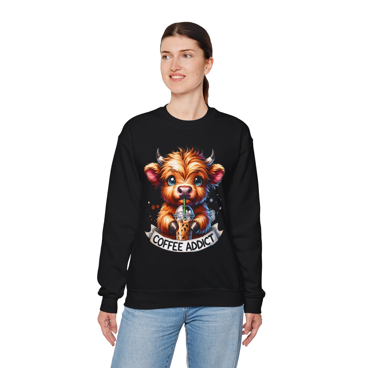 Coffee Addict Highland Cow Drinking Iced Coffee – Gildan Heavy Blend | Trendy Women’s Soft Sweatshirt. Direct to Garment. Printed & Shipped in the USA. Unisex Sizes.