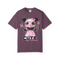 Cute But Feral, Possum in Pink Bibs - Comfort Colors | Trendy Women's T-Shirt. Direct to Garment. Printed & Shipped in the USA. Unisex Sizes.