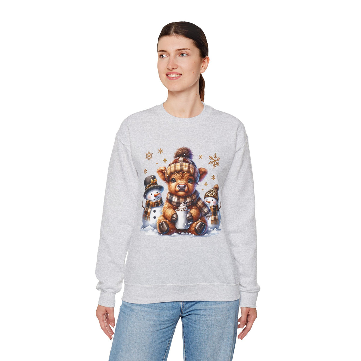 Cute Highland Cow with Snowmen, Winter – Gildan Heavy Blend | Trendy Women’s Soft Sweatshirt. Direct to Garment. Printed & Shipped in the USA. Unisex Sizes.