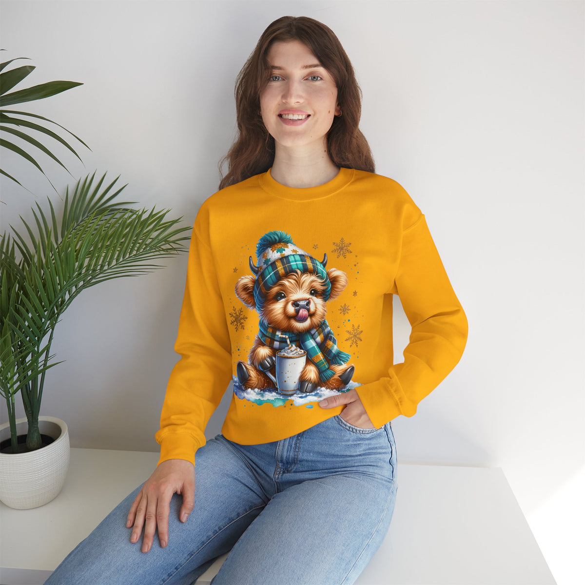 Winter Baby Highland Cow with Cocoa – Gildan Heavy Blend | Trendy Women’s Soft Sweatshirt. Direct to Garment. Printed & Shipped in the USA. Unisex Sizes.