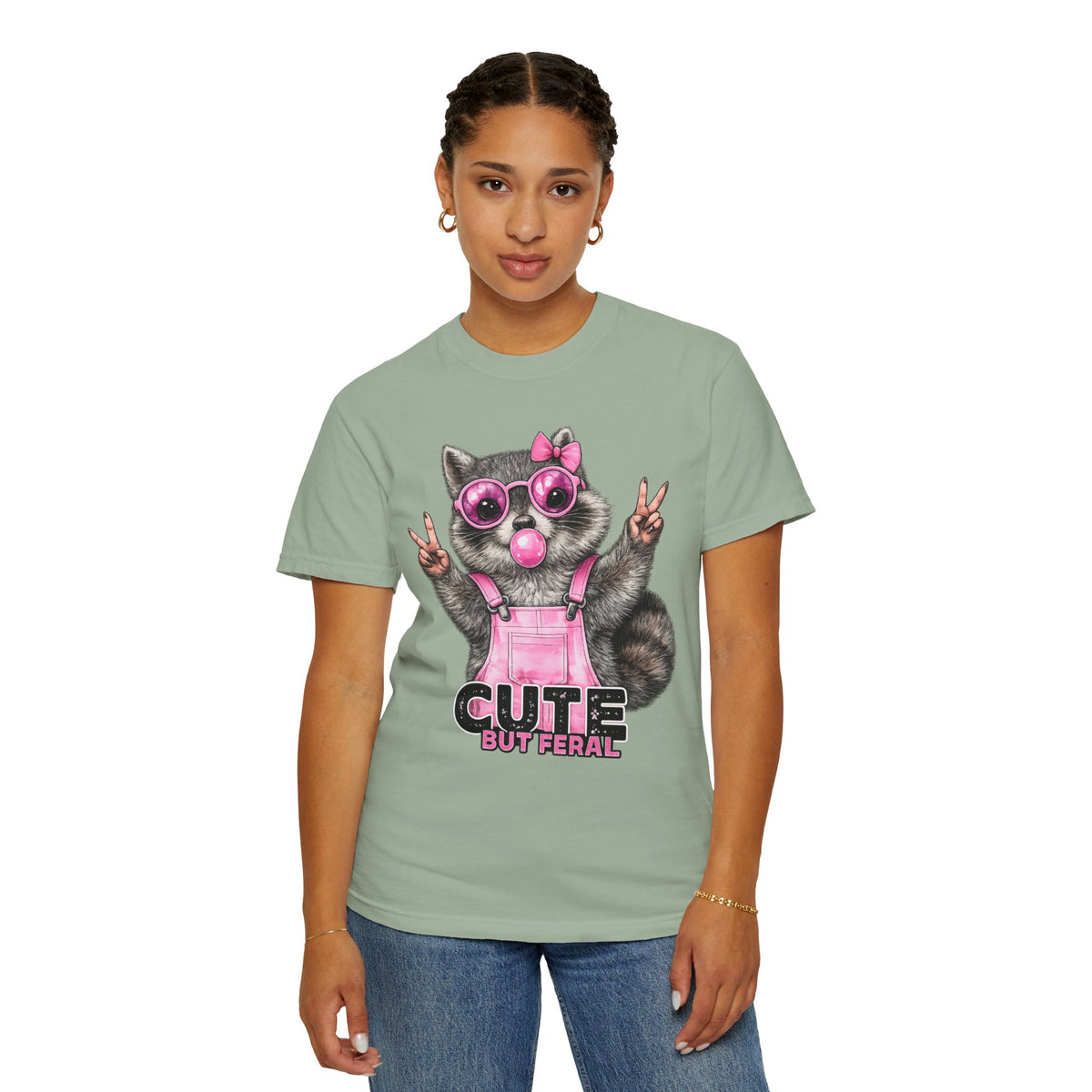 Cute But Feral, Raccoon in Pink Bibs - Comfort Colors | Trendy Women's T-Shirt. Direct to Garment. Printed & Shipped in the USA. Unisex Sizes.