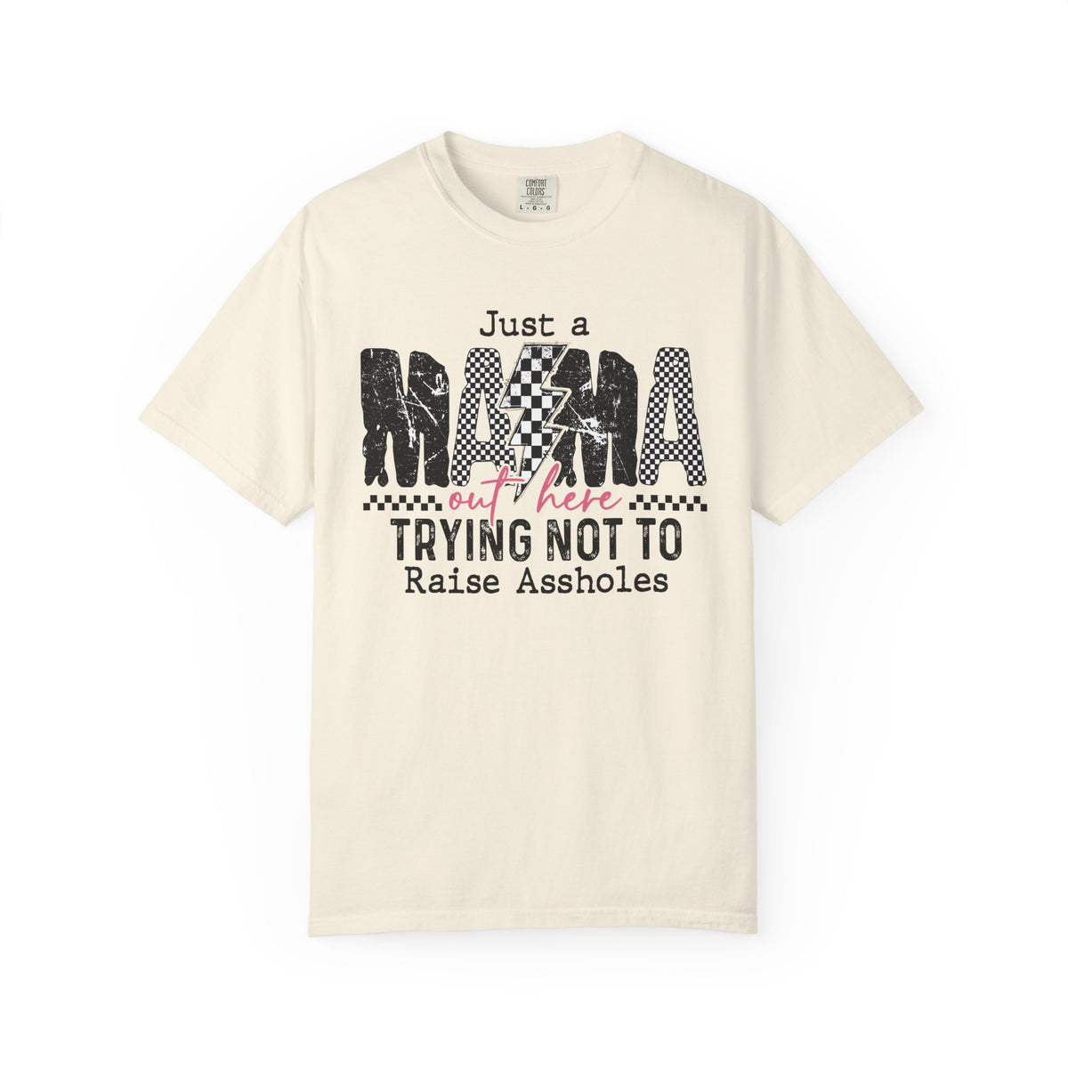 Just a Mama Out Here Trying Not To Raise Assholes - Comfort Colors | Trendy Women's T-Shirt. Direct to Garment. Printed & Shipped in the USA. Unisex Sizes.