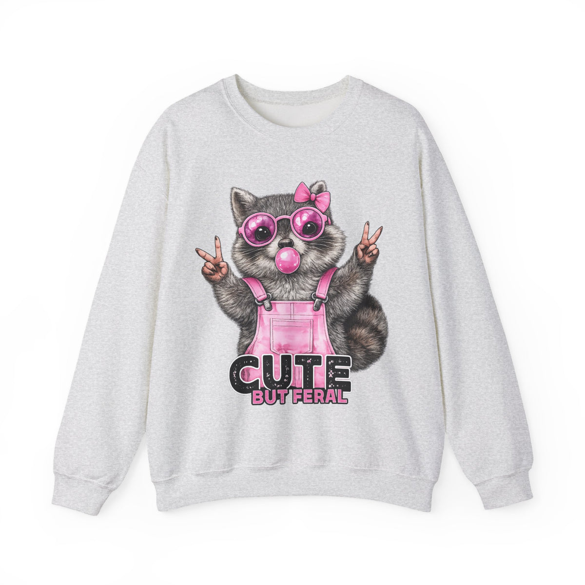 Cute But Feral, Raccoon in Pink Bibs – Gildan Heavy Blend | Trendy Women’s Soft Sweatshirt. Direct to Garment. Printed & Shipped in the USA. Unisex Sizes.