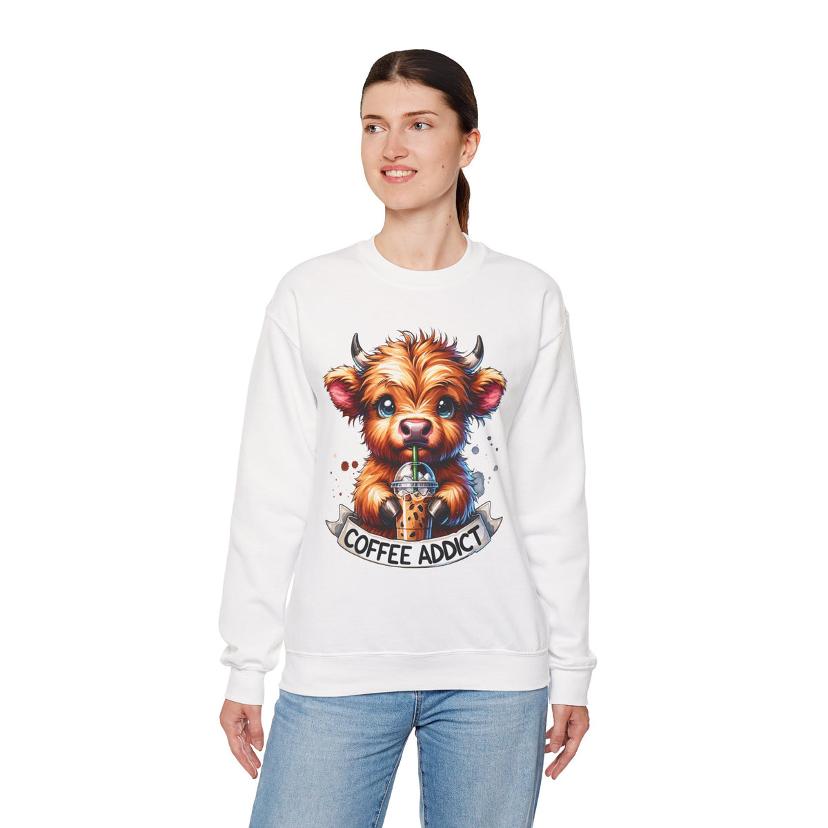 Coffee Addict Highland Cow Drinking Iced Coffee – Gildan Heavy Blend | Trendy Women’s Soft Sweatshirt. Direct to Garment. Printed & Shipped in the USA. Unisex Sizes.