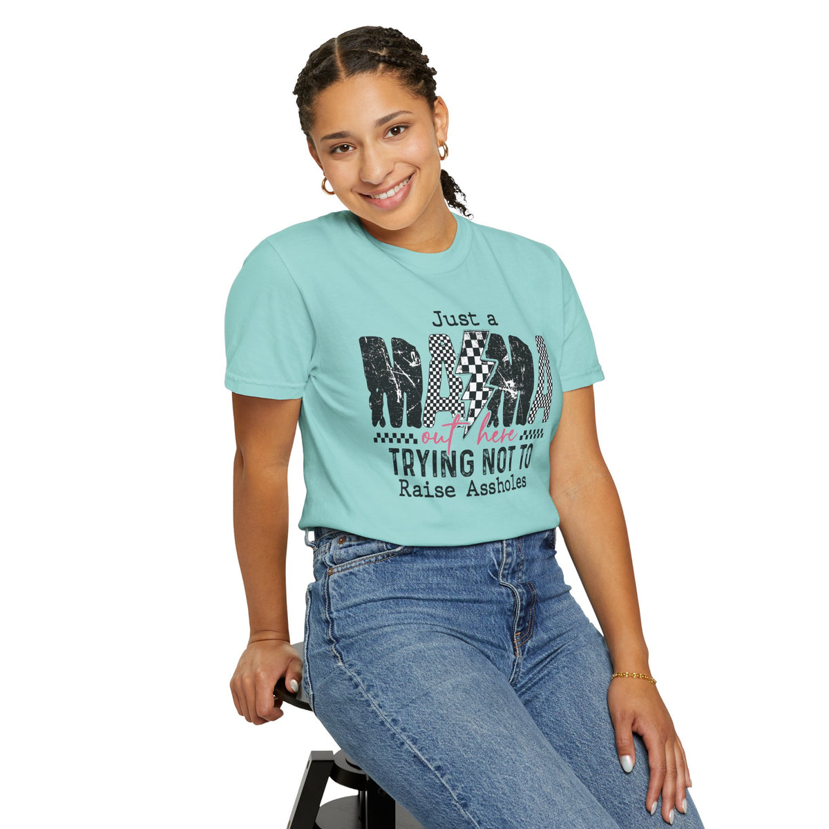 Just a Mama Out Here Trying Not To Raise Assholes - Comfort Colors | Trendy Women's T-Shirt. Direct to Garment. Printed & Shipped in the USA. Unisex Sizes.
