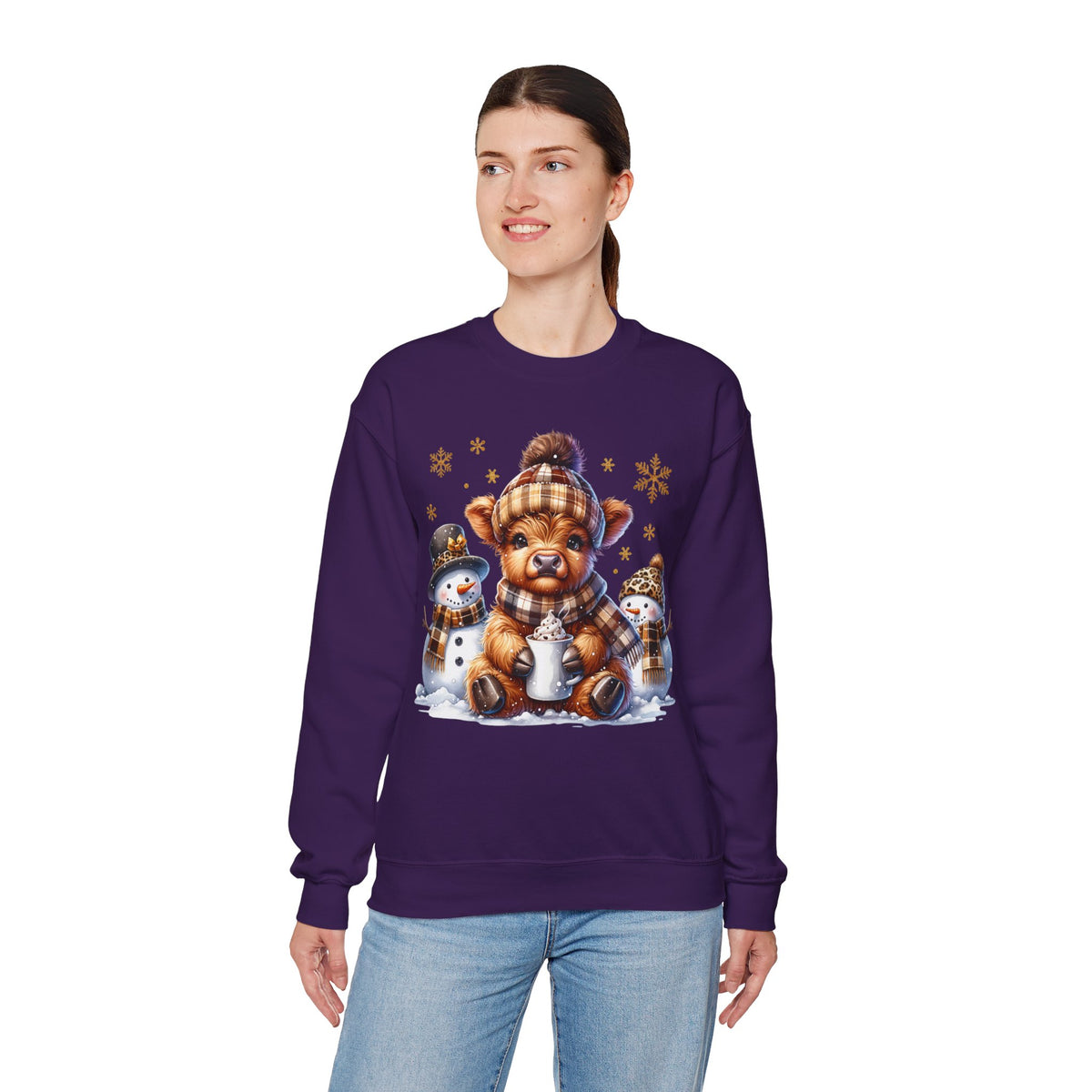 Cute Highland Cow with Snowmen, Winter – Gildan Heavy Blend | Trendy Women’s Soft Sweatshirt. Direct to Garment. Printed & Shipped in the USA. Unisex Sizes.