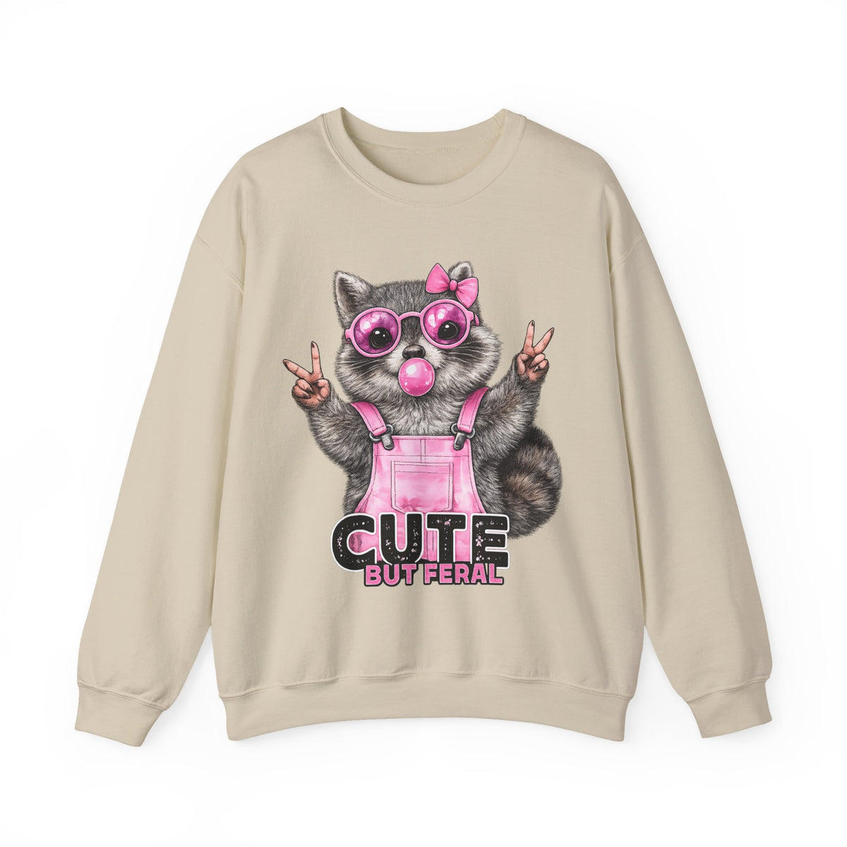 Cute But Feral, Raccoon in Pink Bibs – Gildan Heavy Blend | Trendy Women’s Soft Sweatshirt. Direct to Garment. Printed & Shipped in the USA. Unisex Sizes.