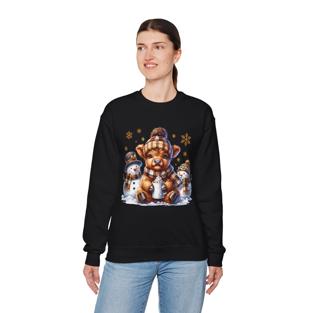 Cute Highland Cow with Snowmen, Winter – Gildan Heavy Blend | Trendy Women’s Soft Sweatshirt. Direct to Garment. Printed & Shipped in the USA. Unisex Sizes.