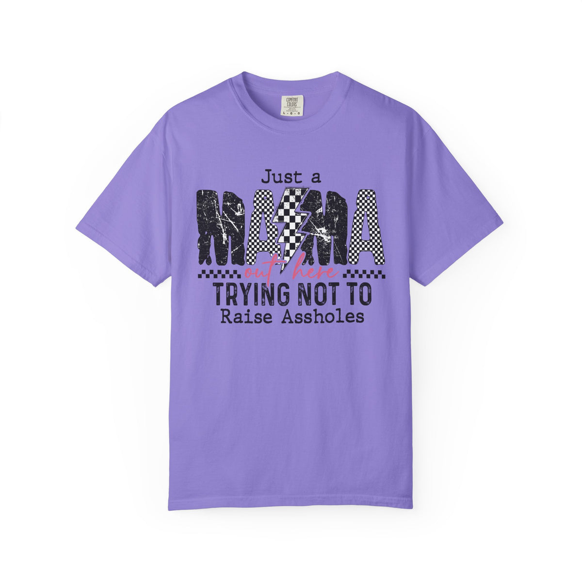 Just a Mama Out Here Trying Not To Raise Assholes - Comfort Colors | Trendy Women's T-Shirt. Direct to Garment. Printed & Shipped in the USA. Unisex Sizes.