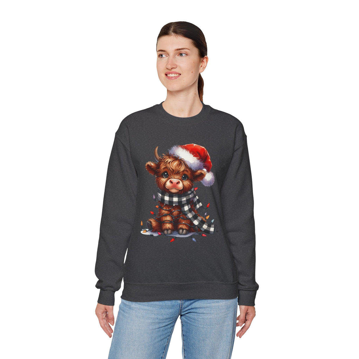 Cute Highland Cow Santa Hat Scarf Christmas Lights – Gildan Heavy Blend | Trendy Women’s Soft Sweatshirt. Direct to Garment. Printed & Shipped in the USA. Unisex Sizes.