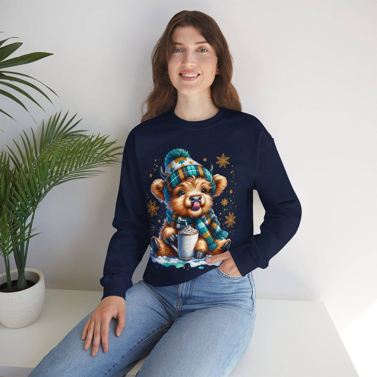 Winter Baby Highland Cow with Cocoa – Gildan Heavy Blend | Trendy Women’s Soft Sweatshirt. Direct to Garment. Printed & Shipped in the USA. Unisex Sizes.