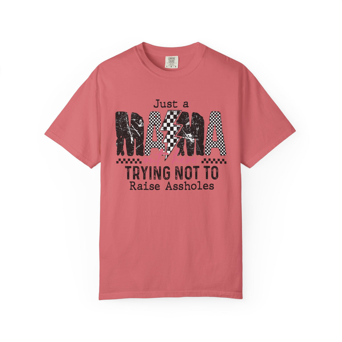 Just a Mama Out Here Trying Not To Raise Assholes - Comfort Colors | Trendy Women's T-Shirt. Direct to Garment. Printed & Shipped in the USA. Unisex Sizes.
