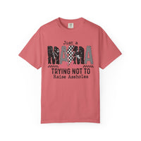 Just a Mama Out Here Trying Not To Raise Assholes - Comfort Colors | Trendy Women's T-Shirt. Direct to Garment. Printed & Shipped in the USA. Unisex Sizes.