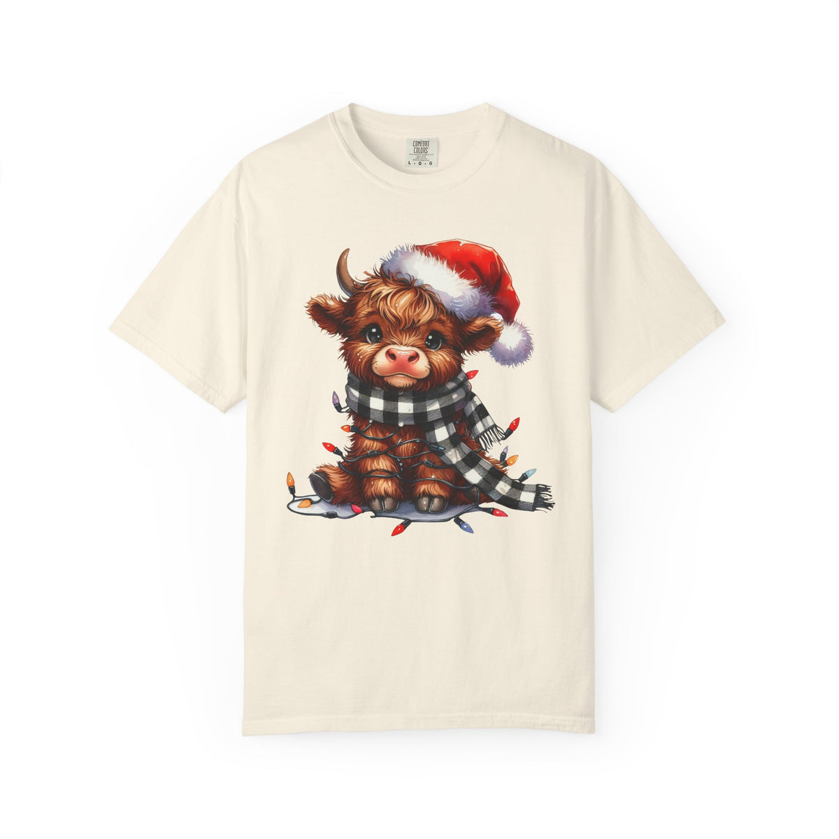 Cute Highland Cow Santa Hat Scarf Christmas Lights - Comfort Colors | Trendy Unisex T-Shirt. Direct to Garment. Printed & Shipped in the USA. Unisex Sizes.
